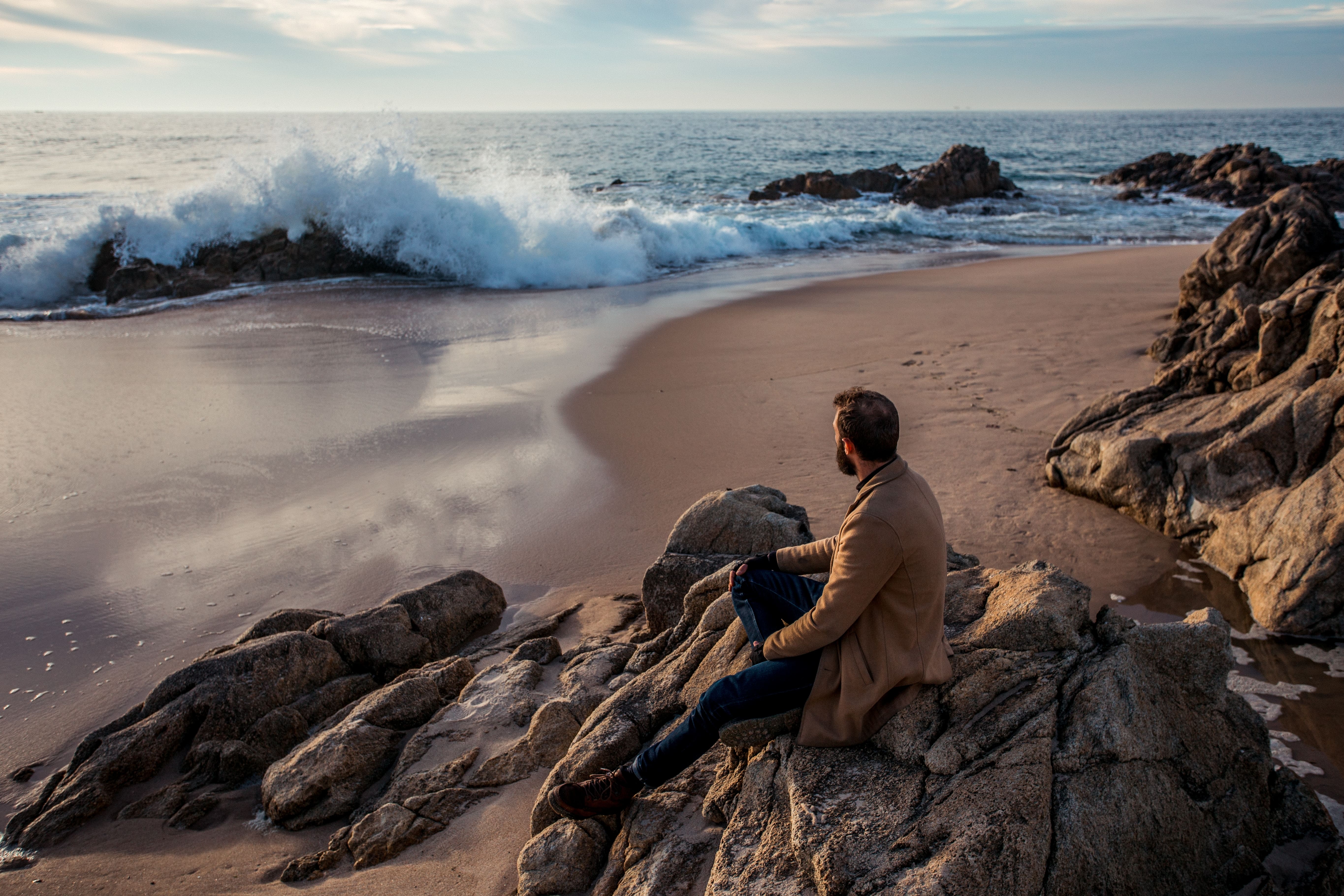 man sitting on a rock