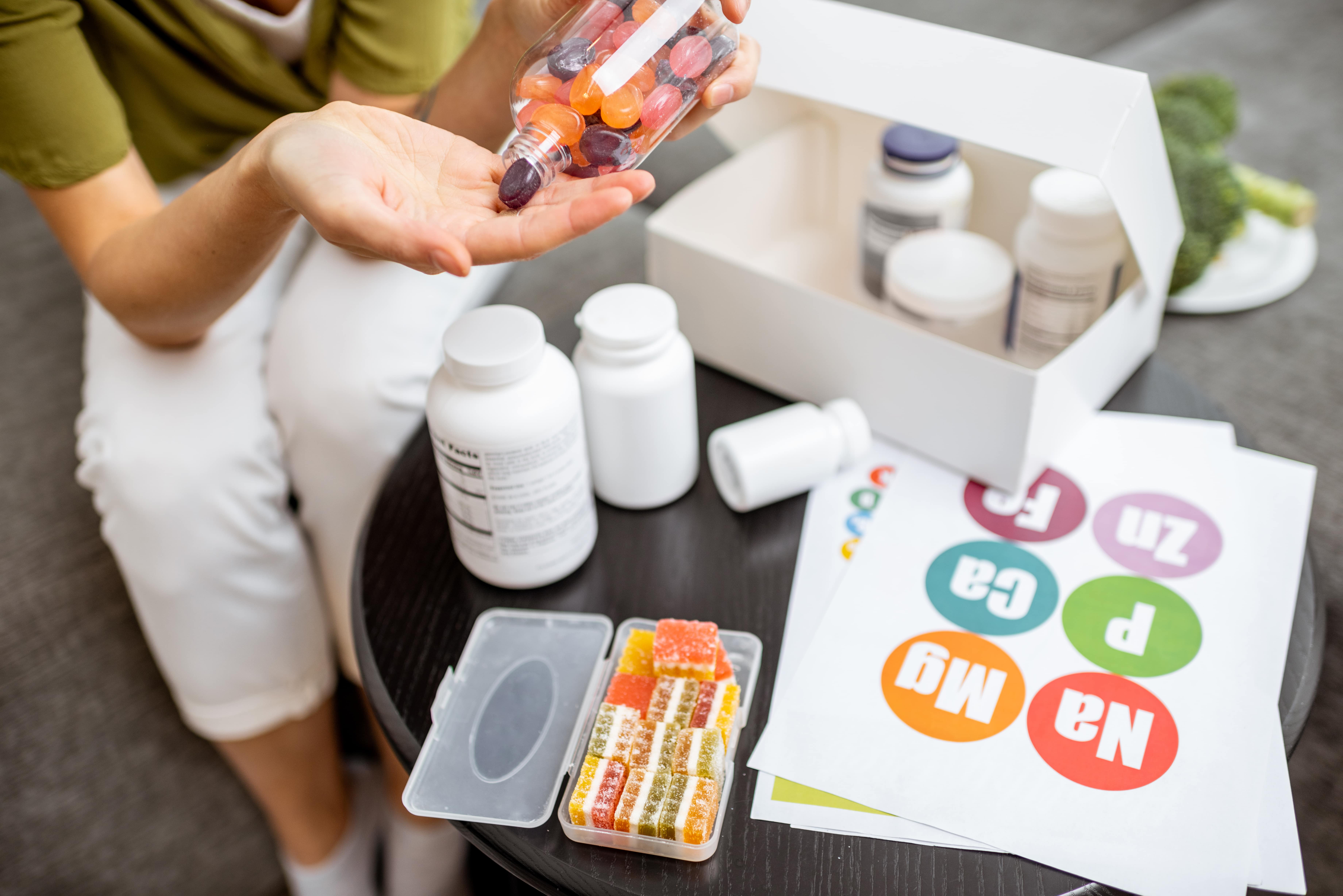 woman with supplement boxes