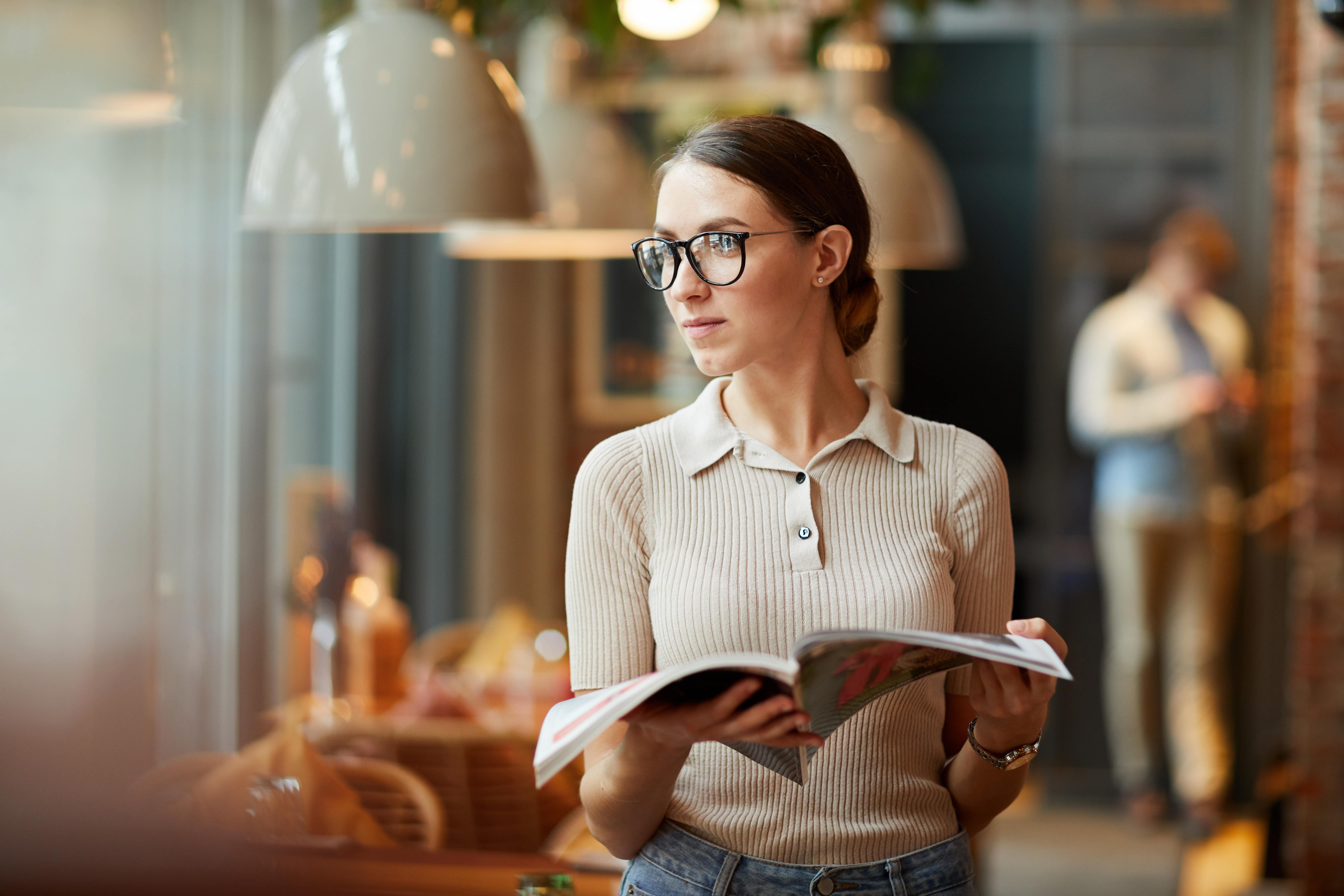 woman reading a business magazine