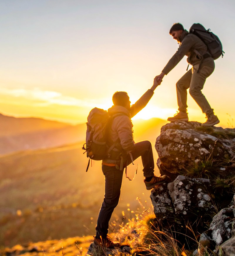 Climbers helping each other
