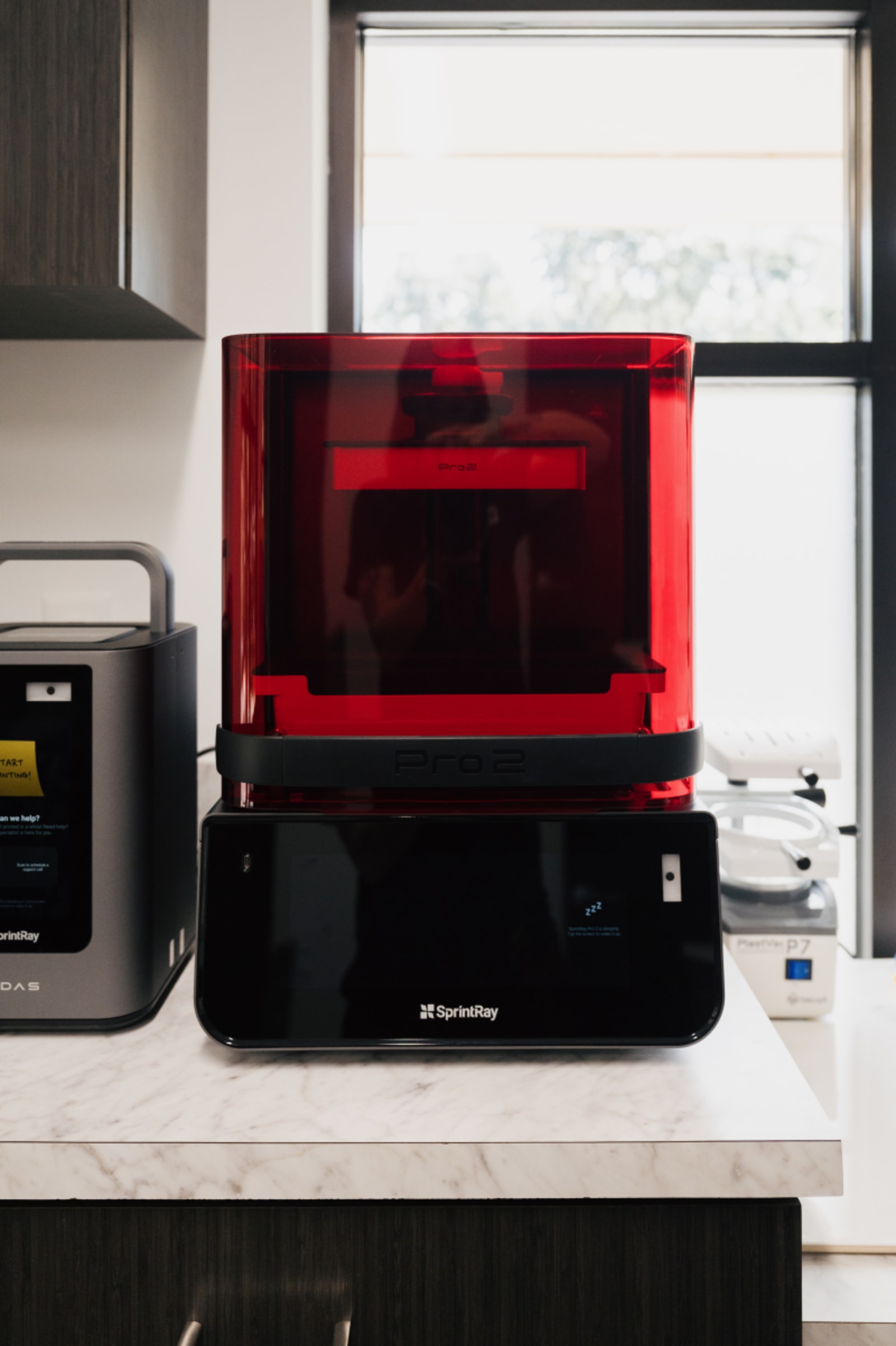3D printer in dental office creating custom retainers