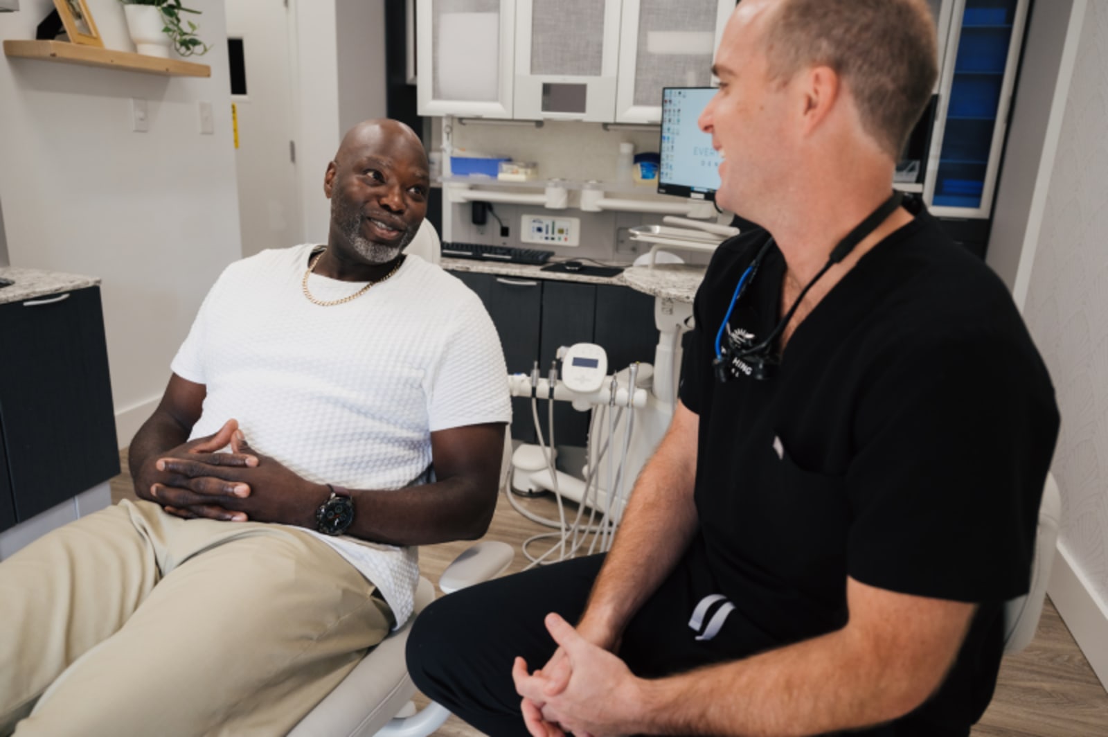 Dentist discussing treatment plan with patient during orthodontic assessment