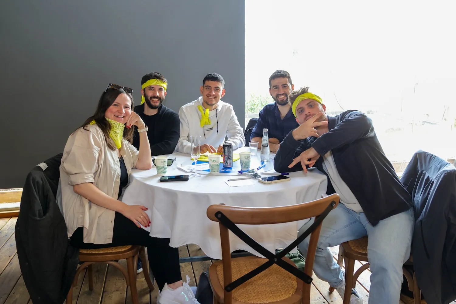 A group of people sitting around a table.