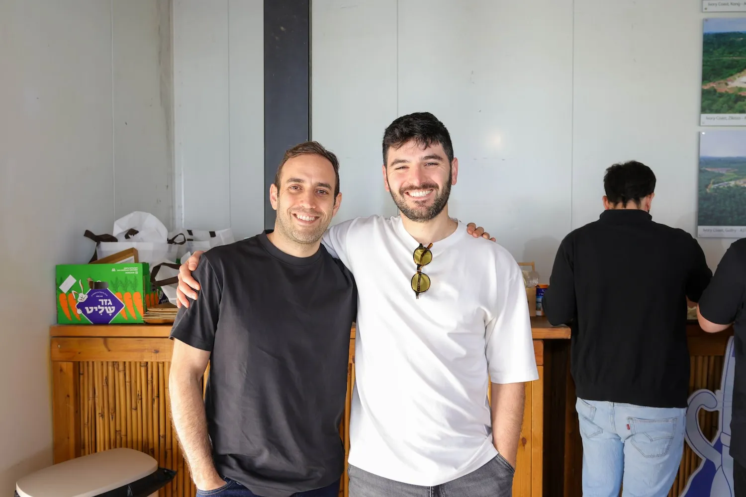 A couple of men standing next to each other.