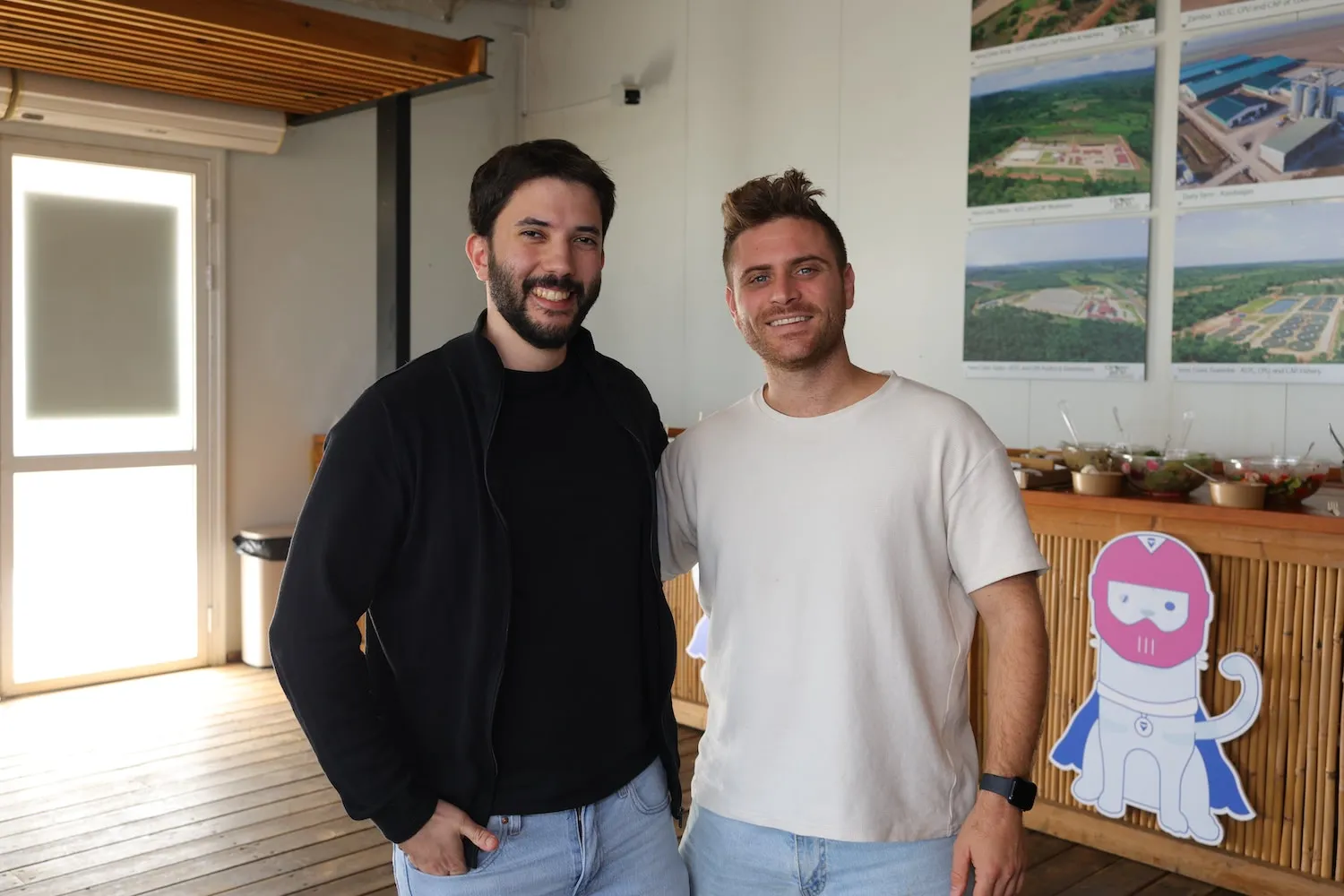 A couple of men standing next to each other.