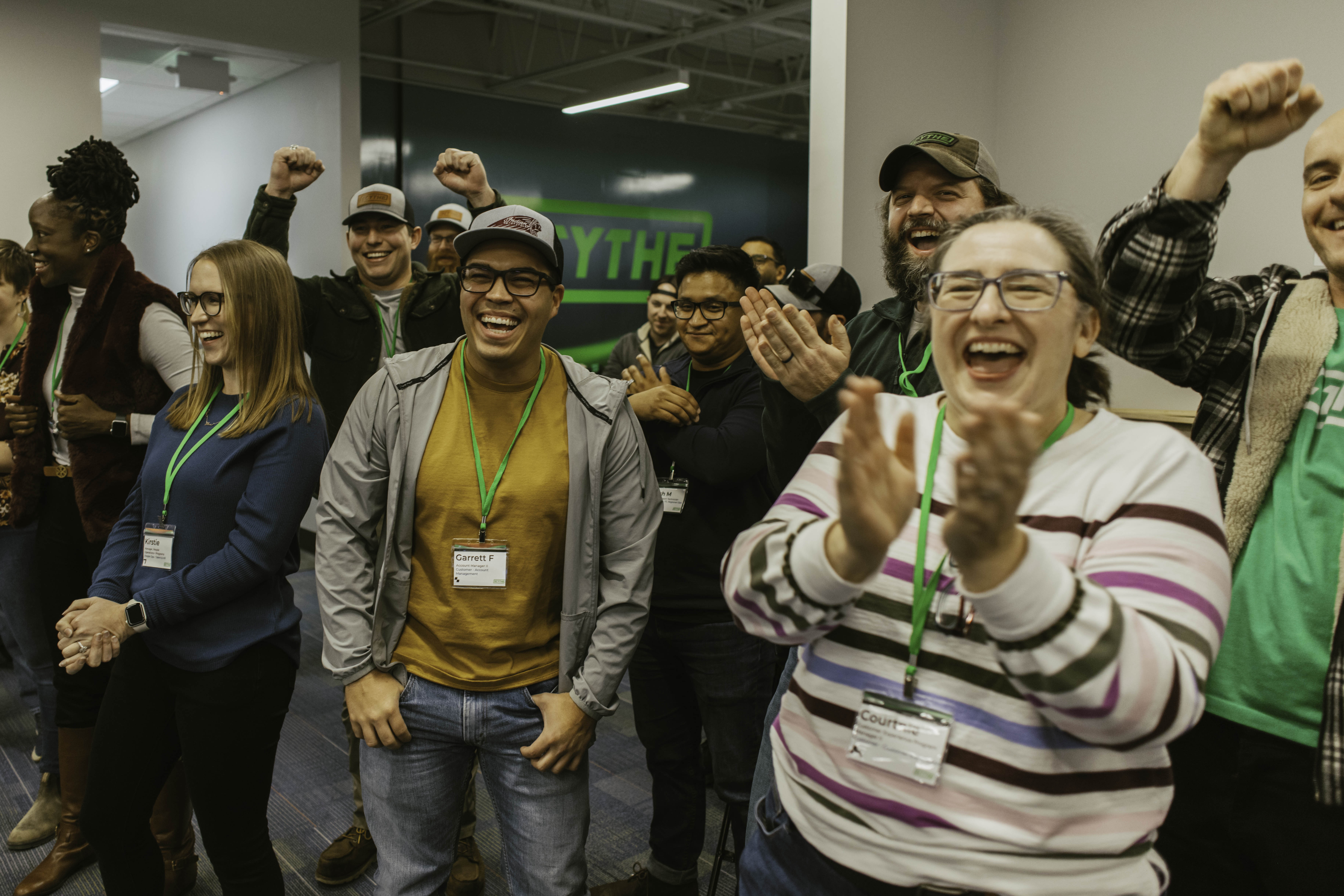 A bunch of people clapping and cheering