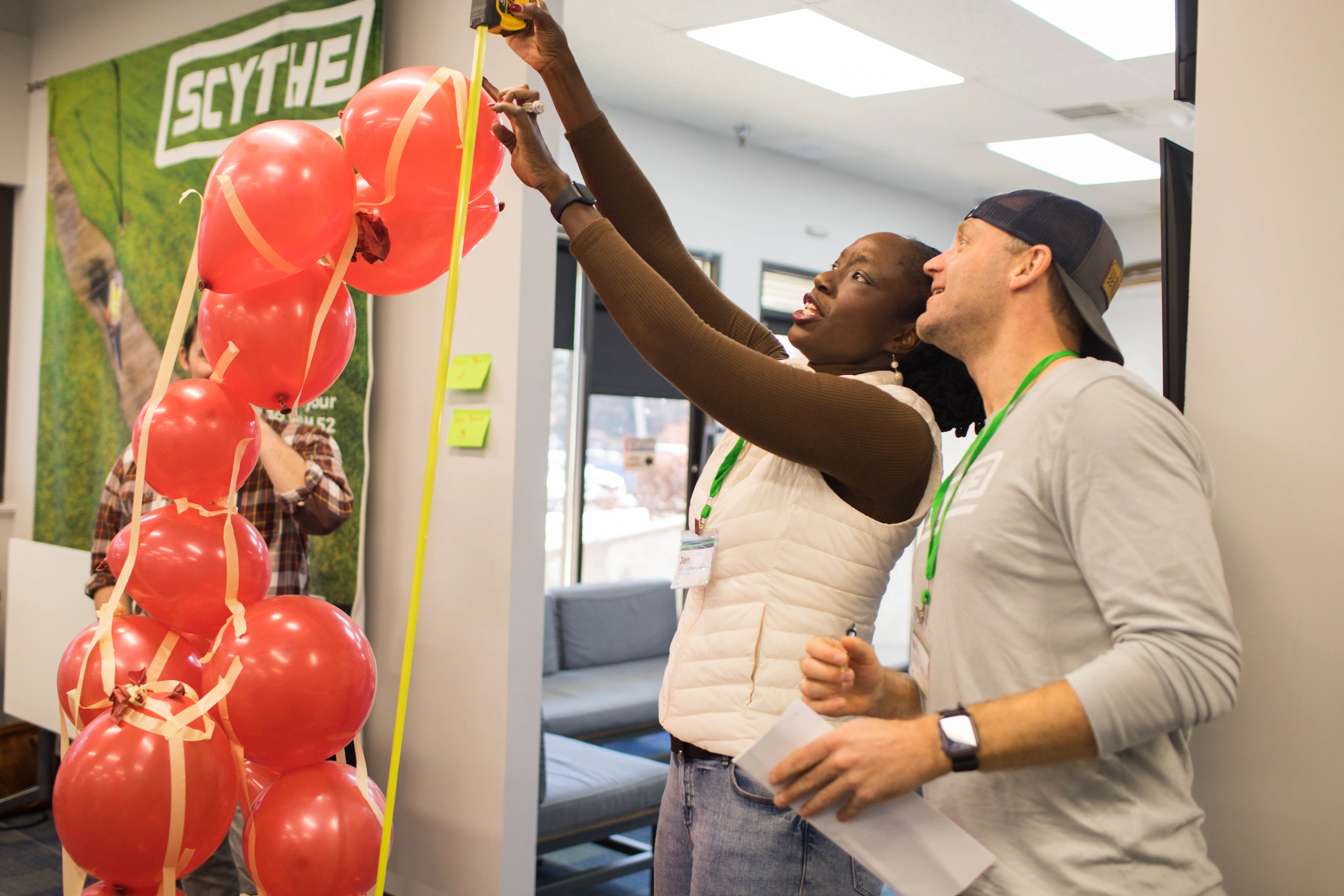 Two people looking at a collection of balloons