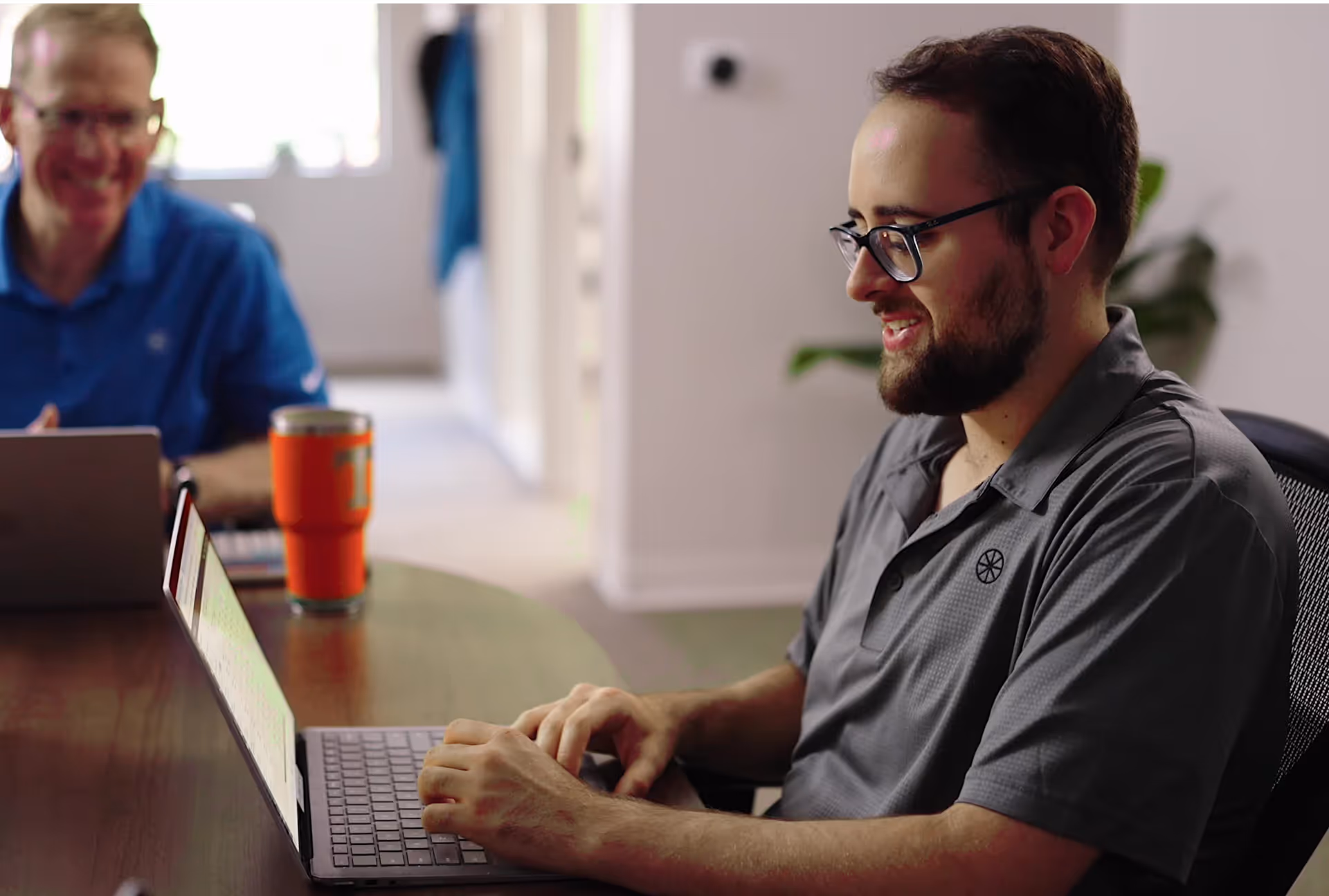 Two EverSource Wealth Advisor employees discussing finances.  