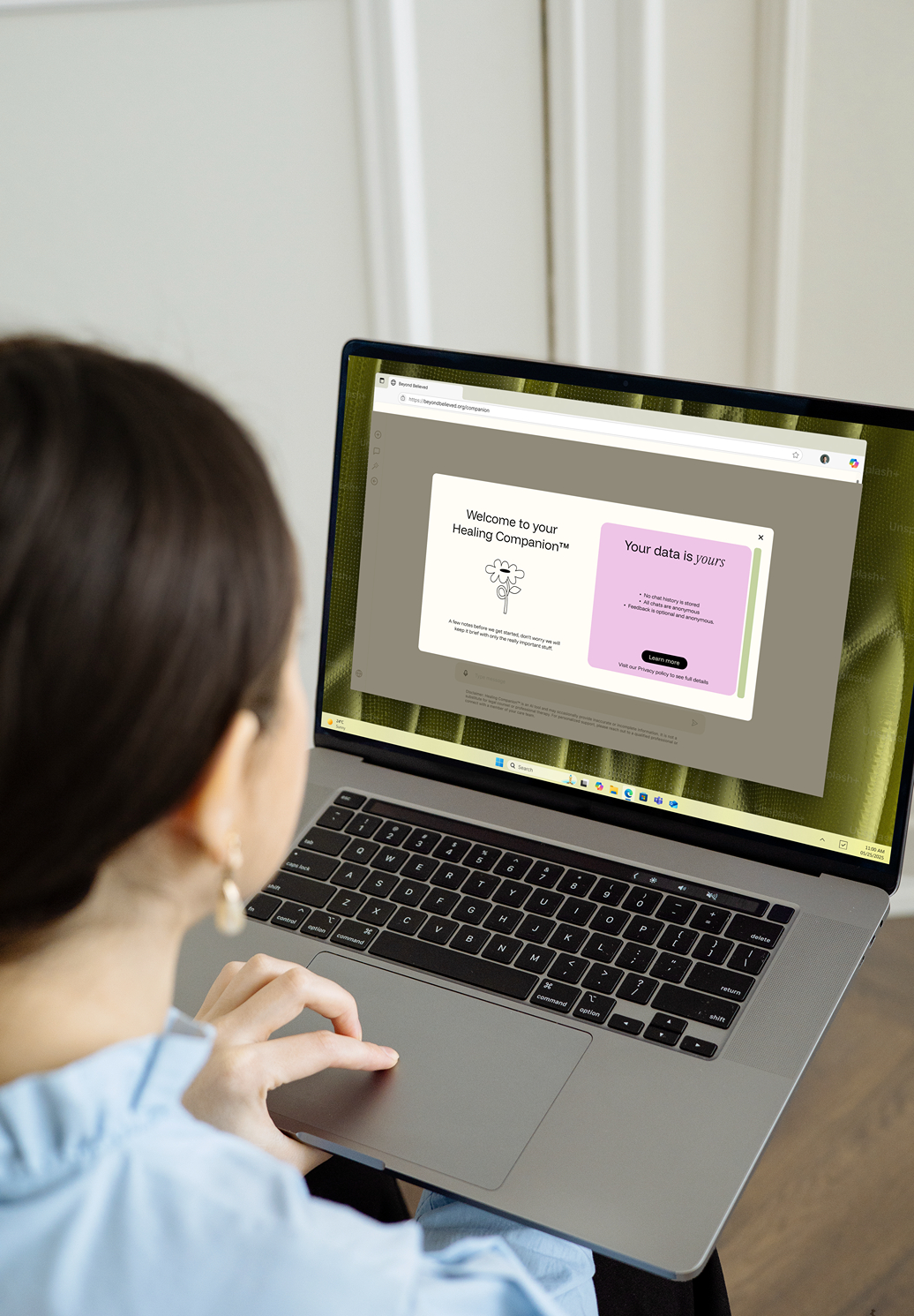 Girl sitting typing on laptop