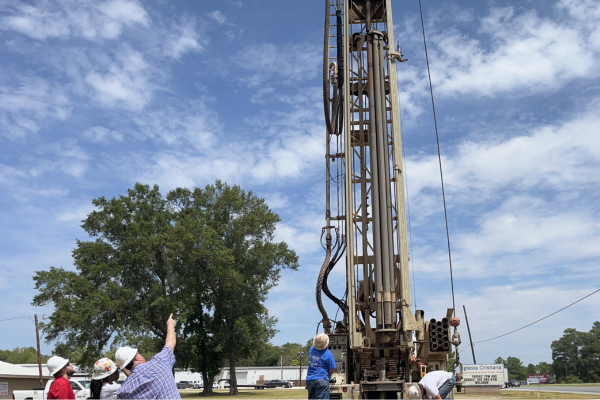 BASS technicians performing cathodic protection maintenance on pipeline infrastructure in the field
