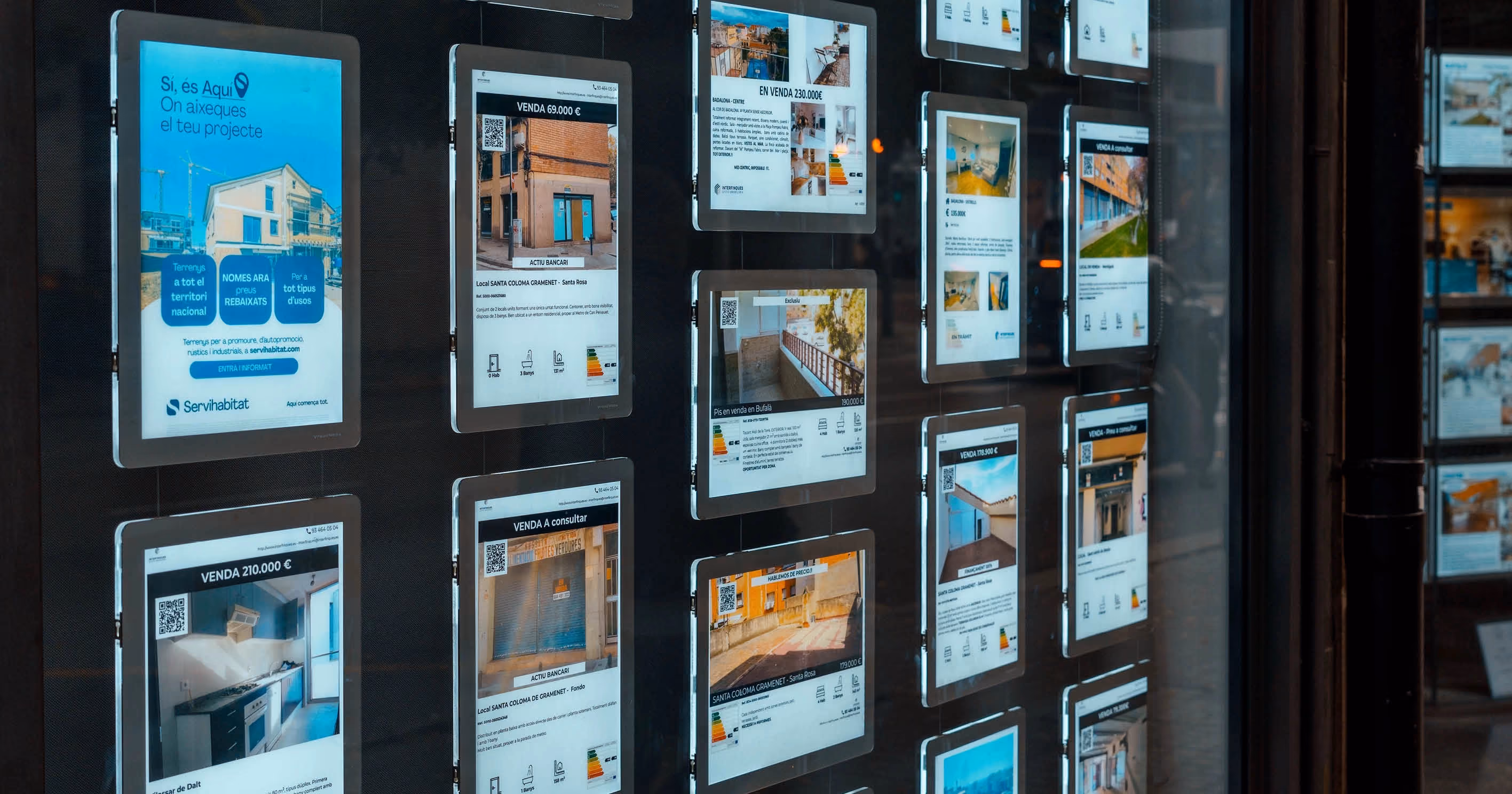 An estate agency window with property listings