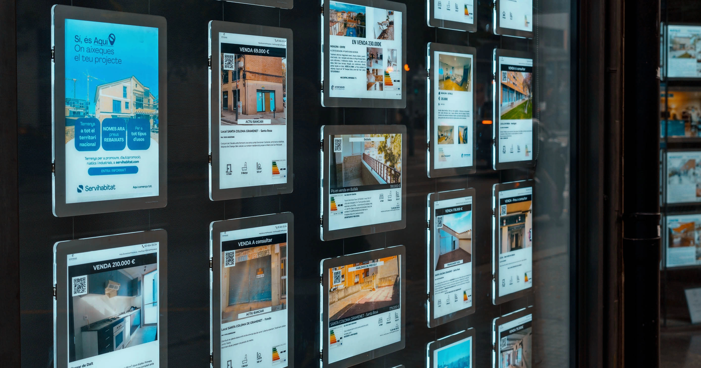 An estate agency window with property listings