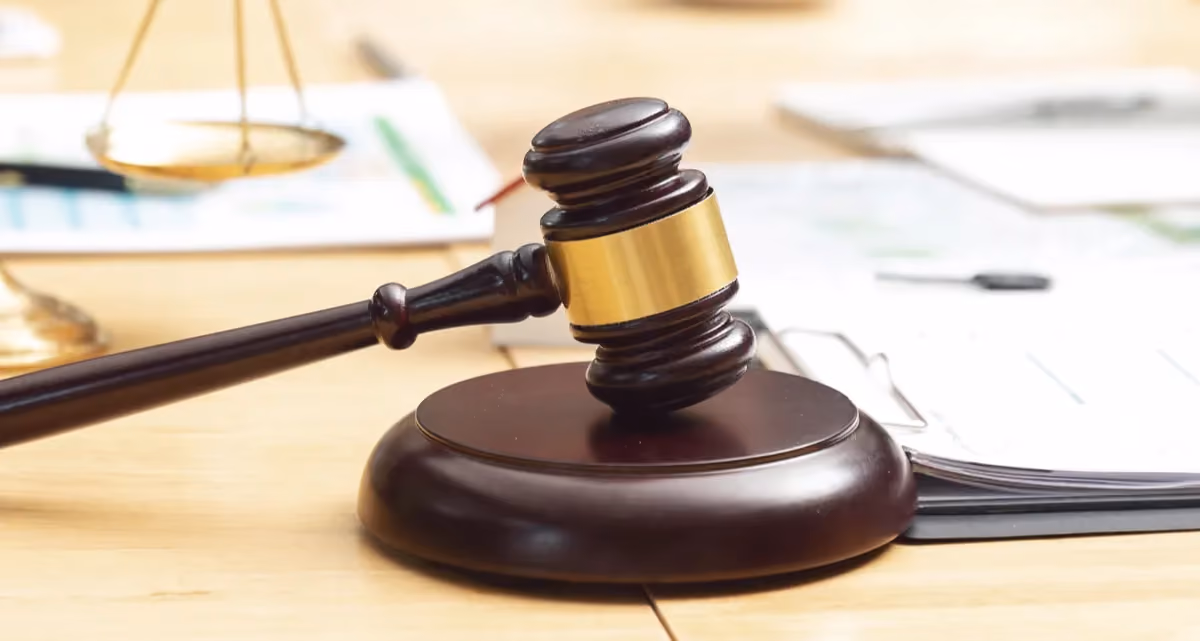 A gavel surrounded by documents