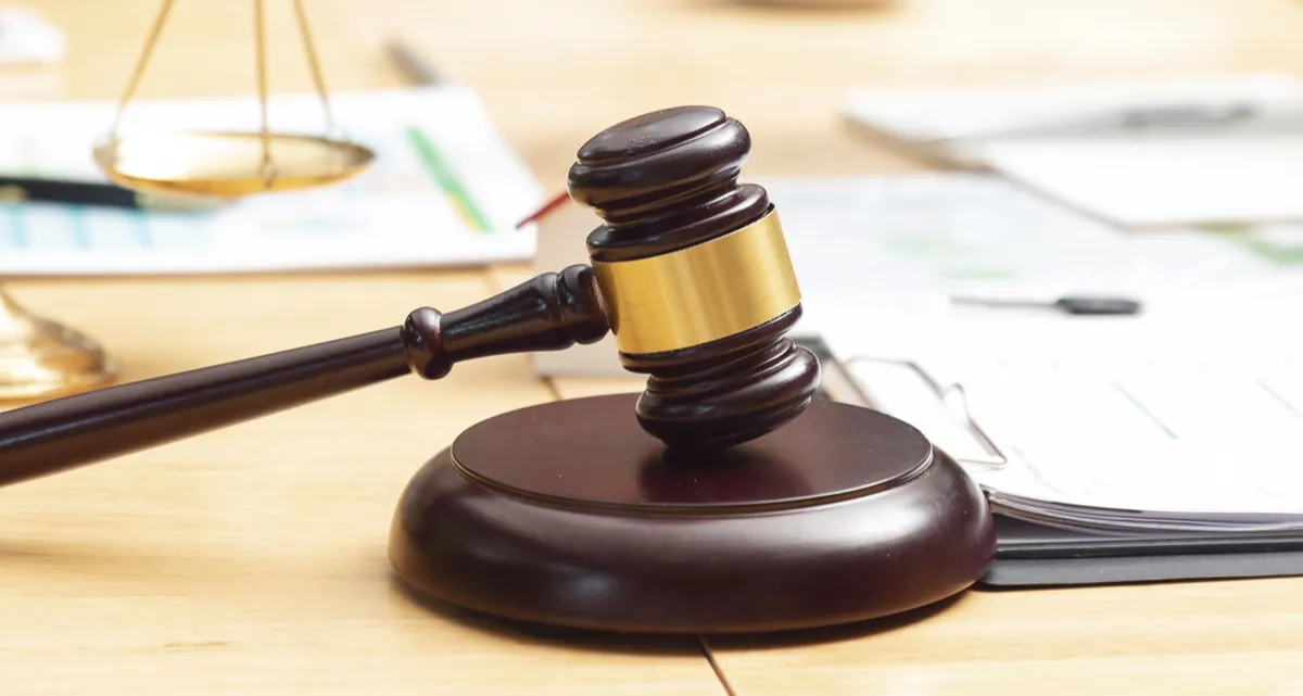 A gavel surrounded by documents