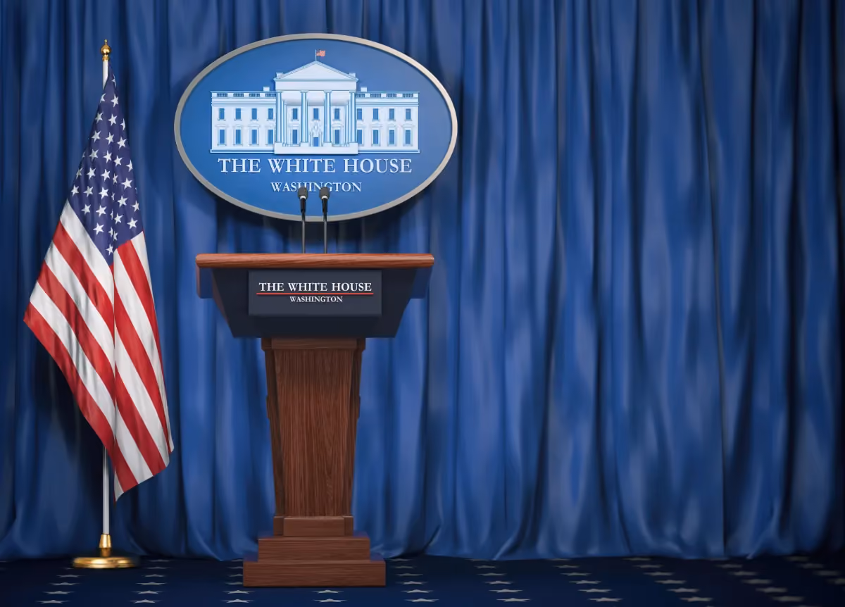 Podium with USA flags and White House emblem