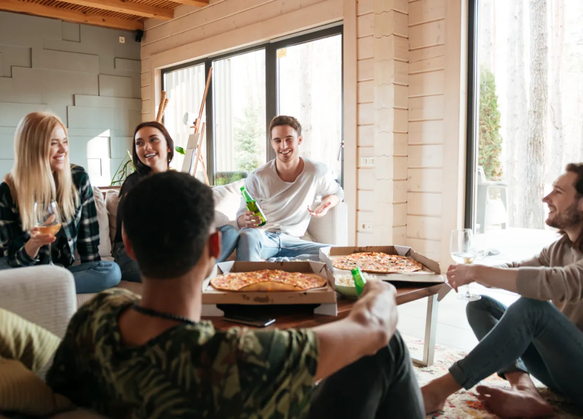 Group of roommates eating pizza