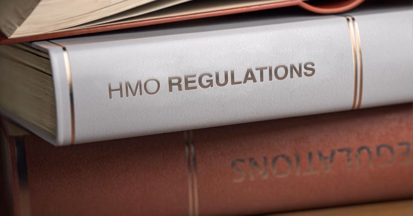 A book with the title "HMO Regulations"