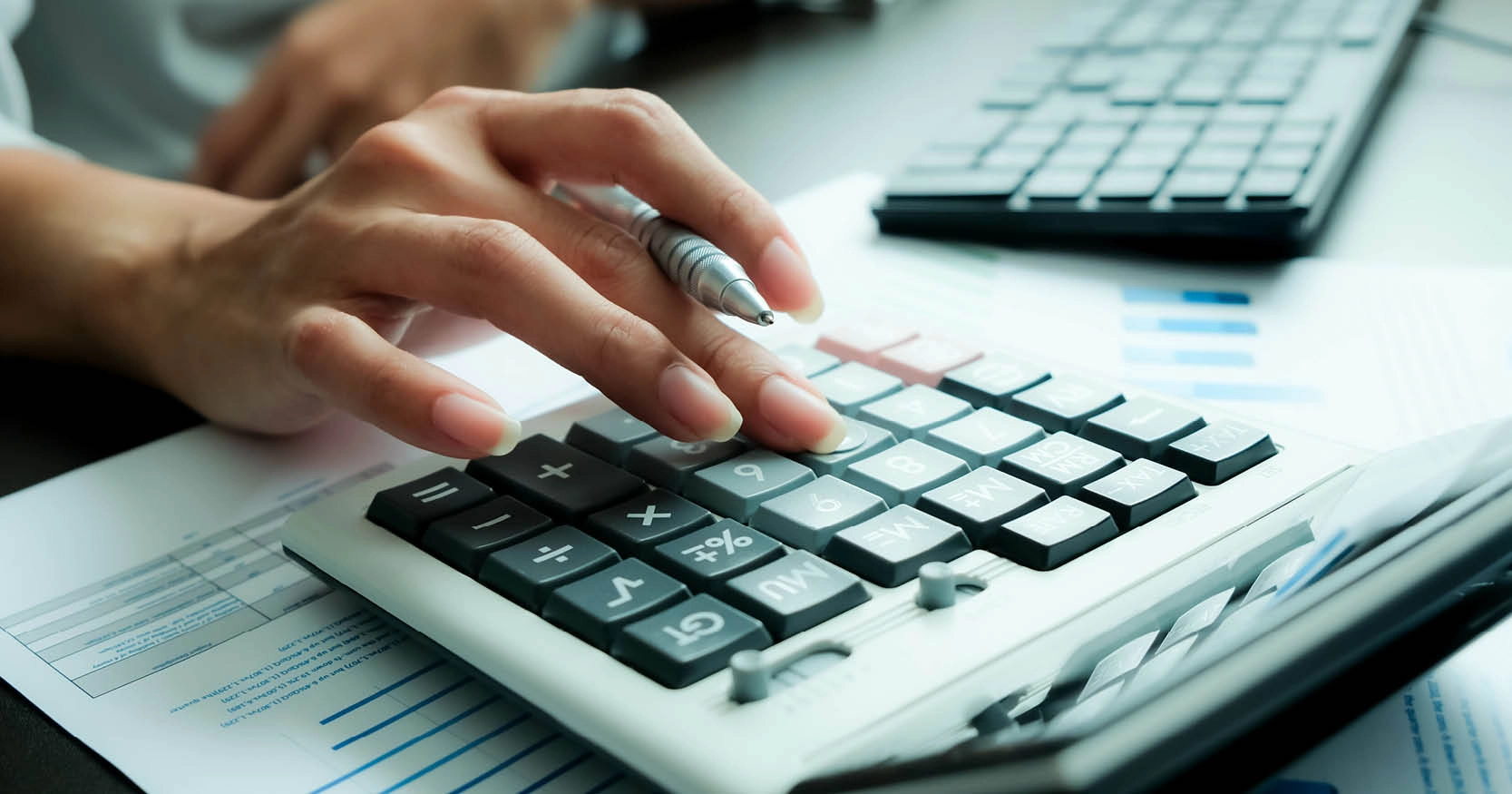 A person using a calculator