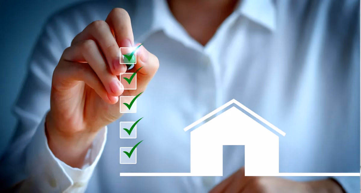 A person ticking a box next to a flat image of a house
