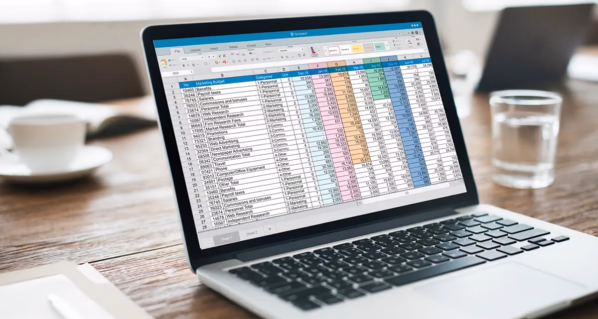 A laptop screen showing a spreadsheet with figures
