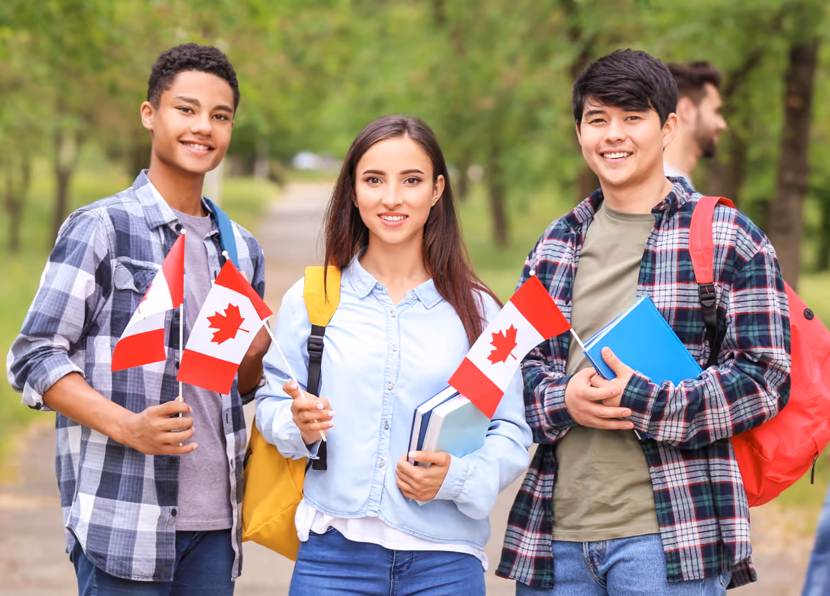 Group of students holding Canadian flags