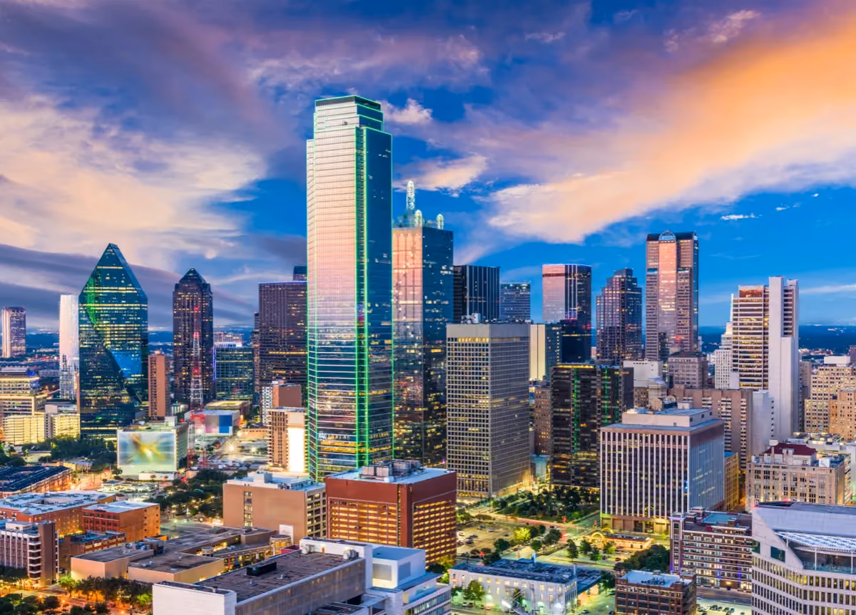 A vibrant cityscape showing the Dallas, Texas skyline