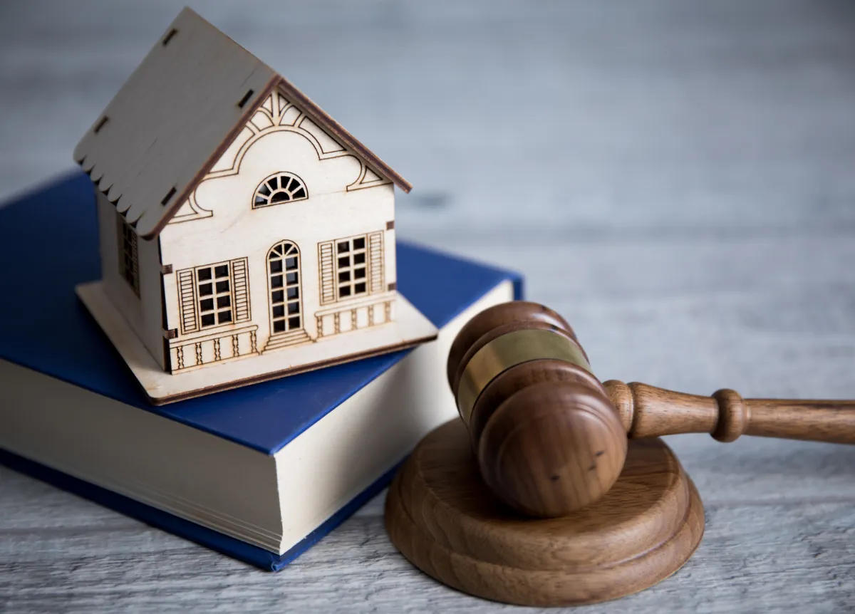 Model of house next to gavel