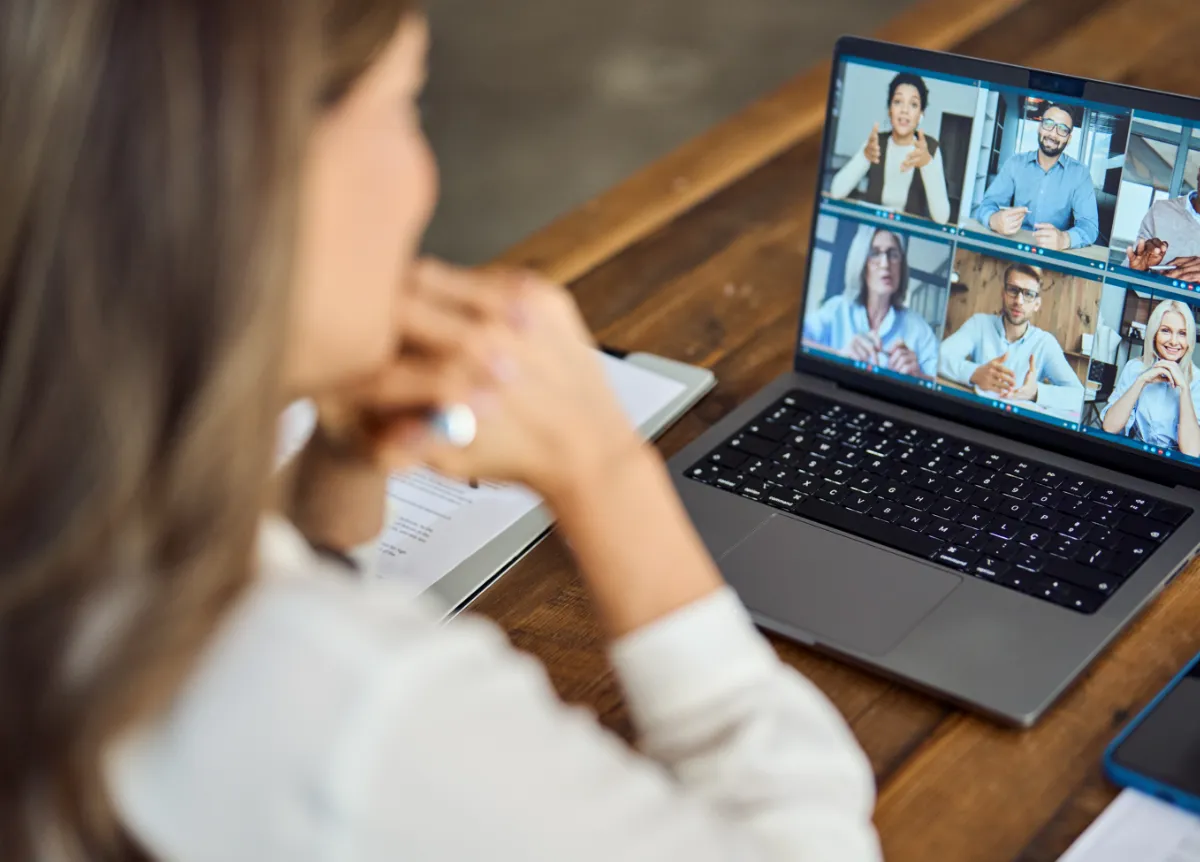 Businesswoman on Zoom call with other businesspeople