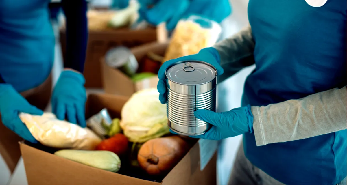 People handing out food at a food bank