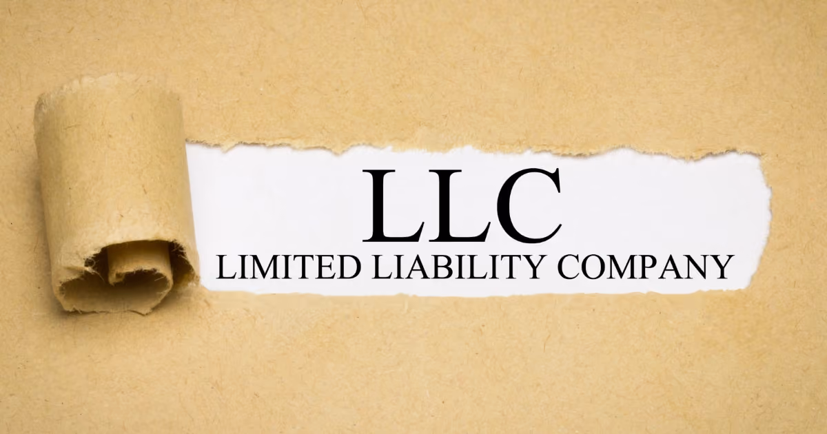 A piece of paper with "LLC – Limited liability company" written on it