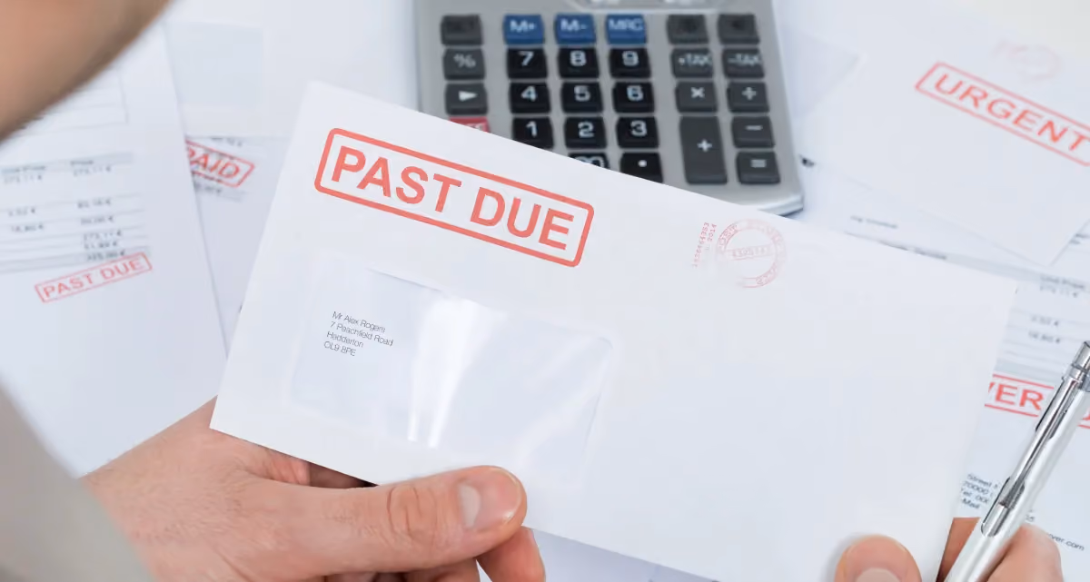 A envelope with a red "Past due" stamp on it
