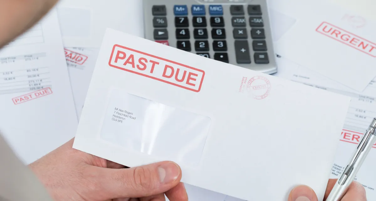 A envelope with a red "Past due" stamp on it