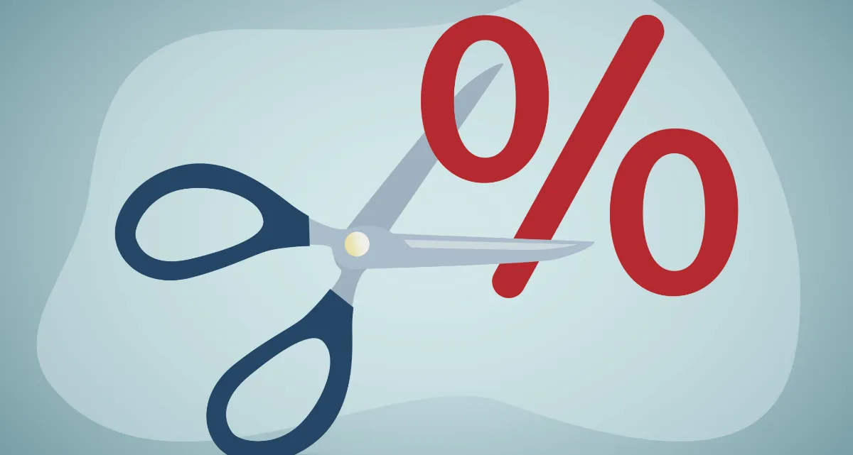 A pair of scissors cutting a percentage sign