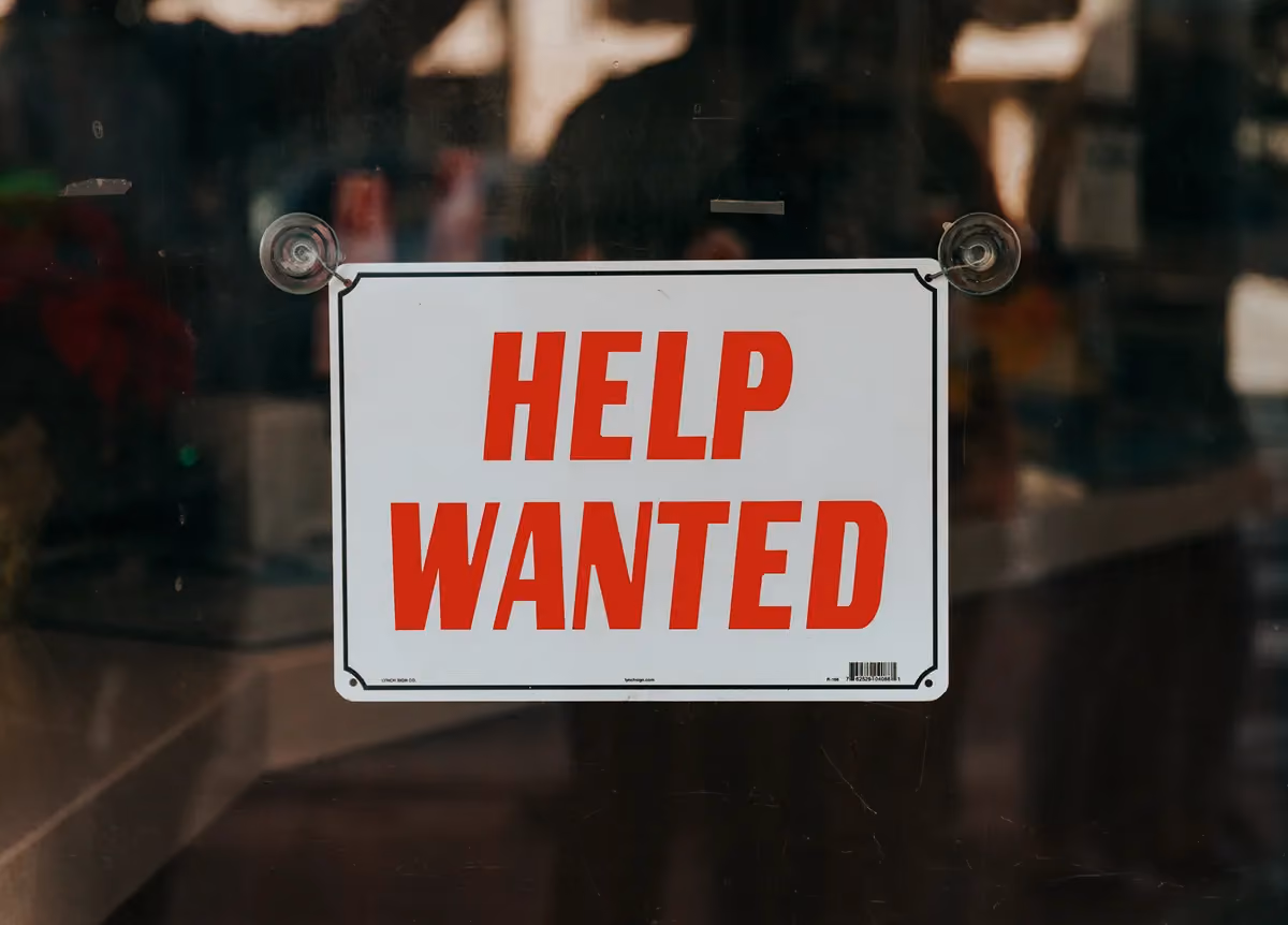 'Help wanted' sign in window