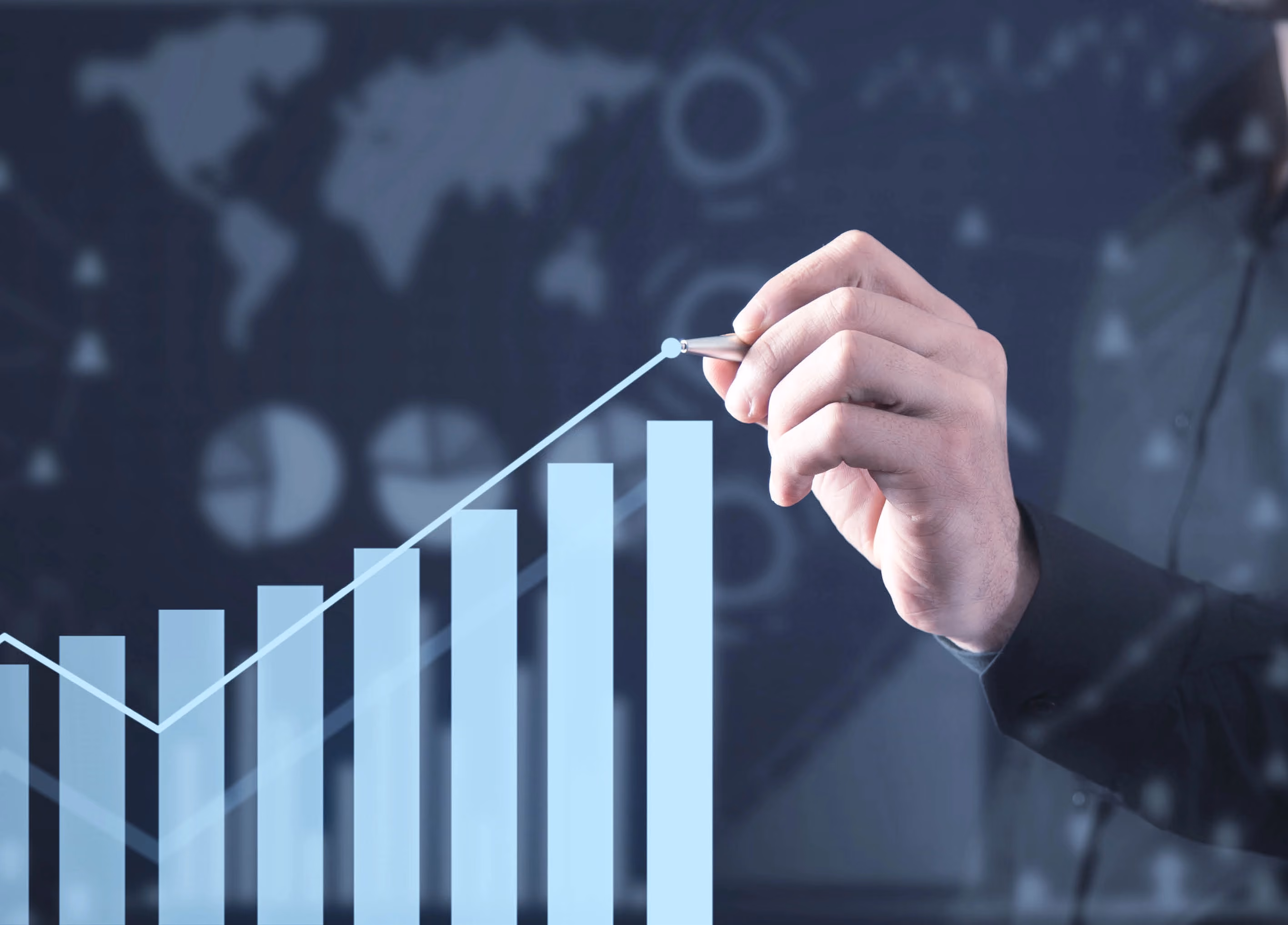 Man draws upward-trending graph. Concept of financial growth.