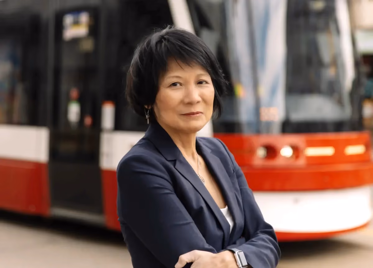 Olivia Chow posing confidently with arms crossed