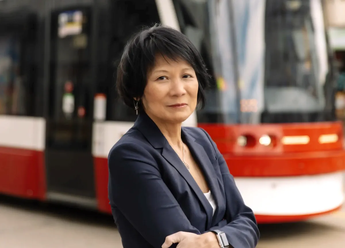 Olivia Chow posing confidently with arms crossed