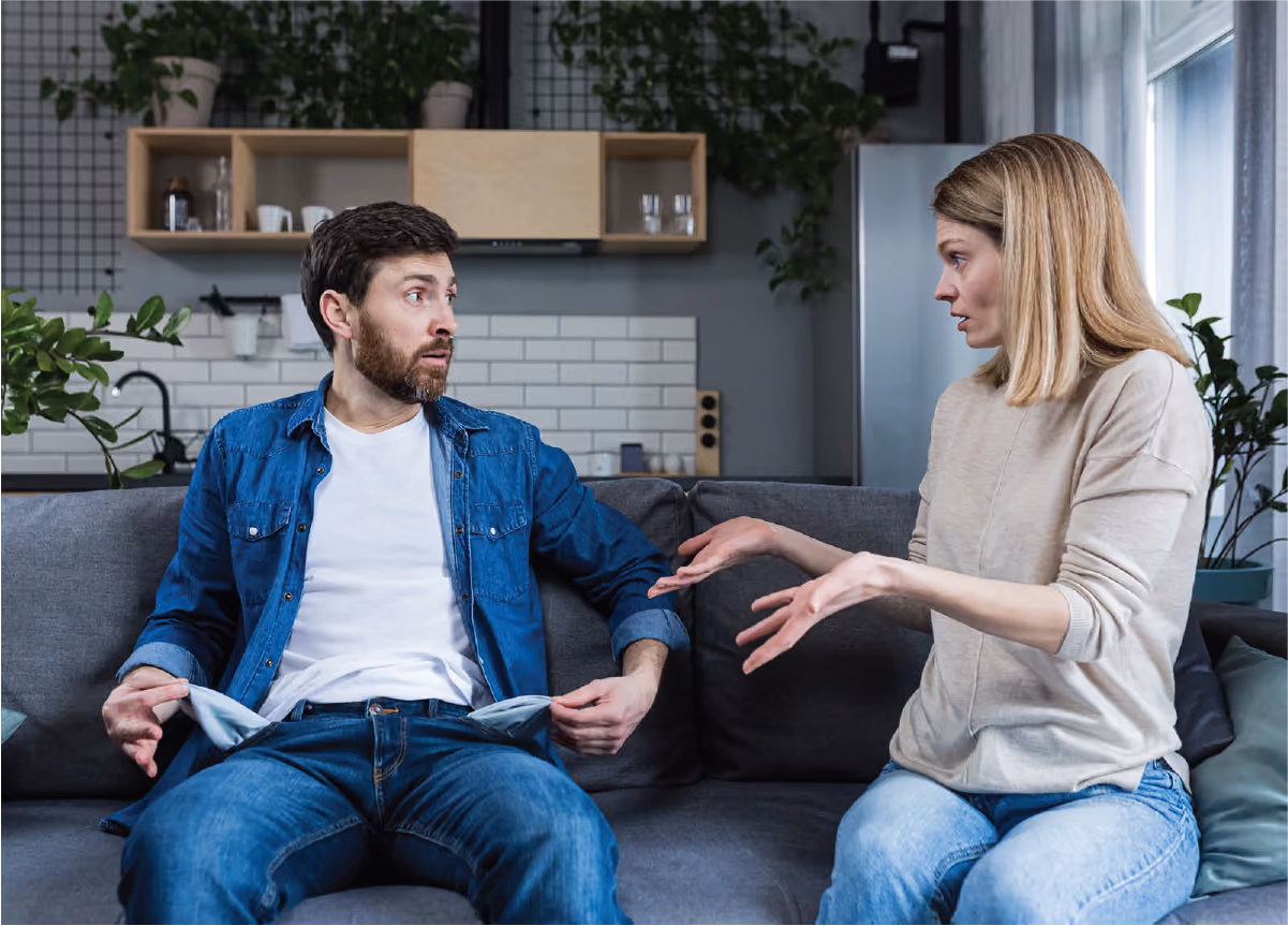 Woman demands money from man, who shows her empty pockets.