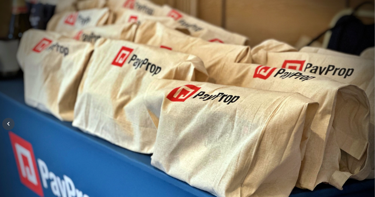 A table of PayProp tote bags at PayProp Connect