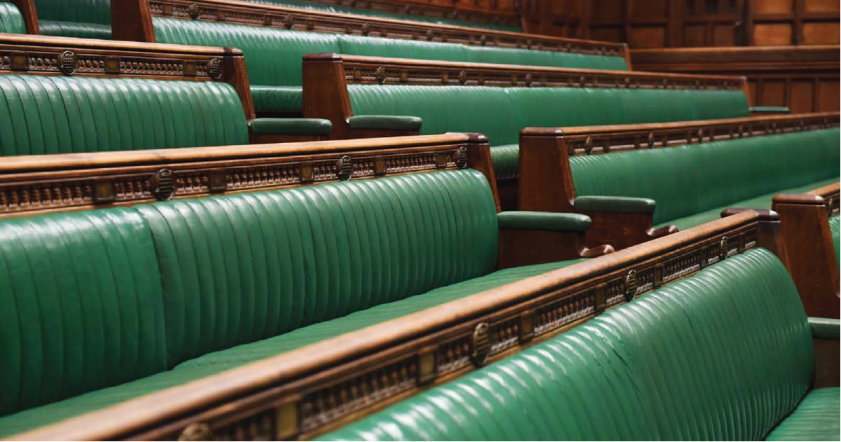 Empty green benches in the House of Commons