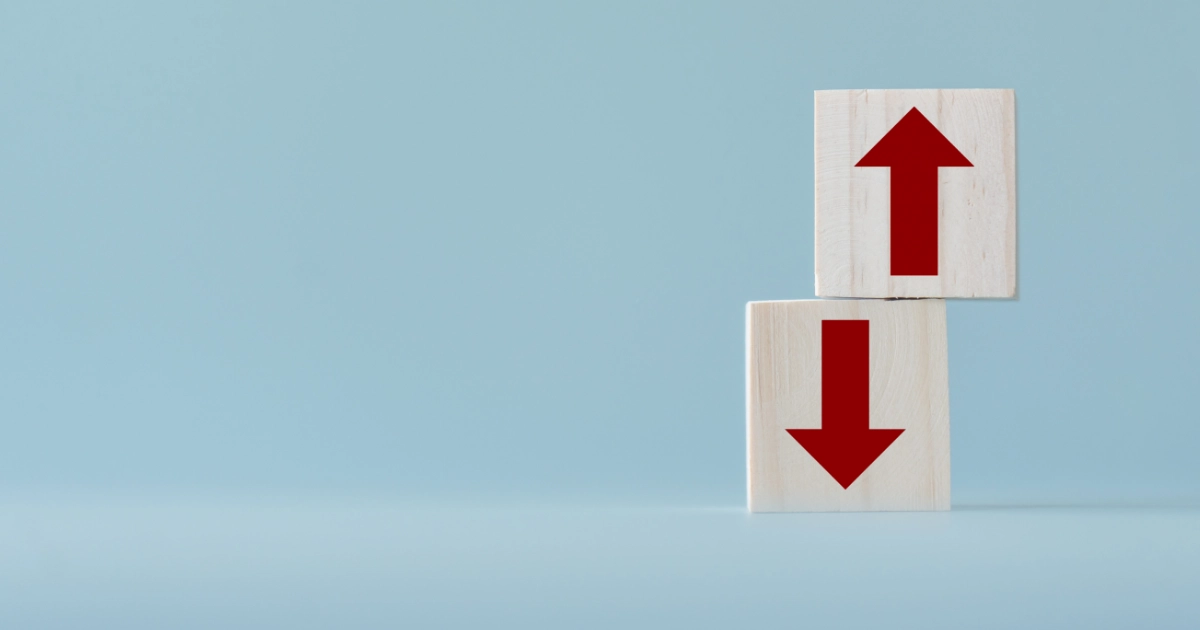 Two arrows, one pointing up and one pointing down, on a blue background