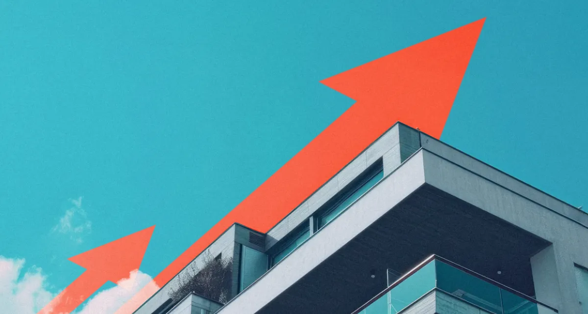 A graphic of a red arrow rising into a blue sky above the roof of a building
