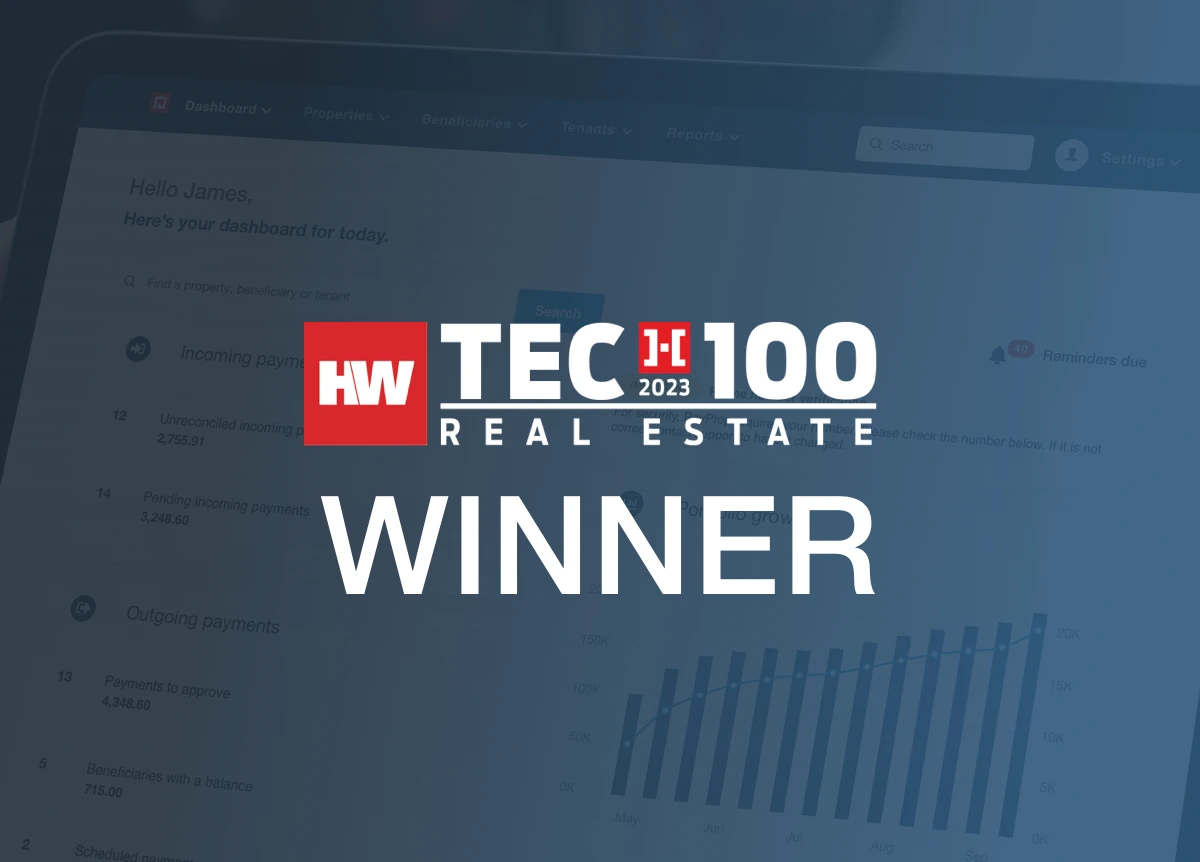 HousingWire Tech100 Real Estate Award logo in front of PayProp dashboard