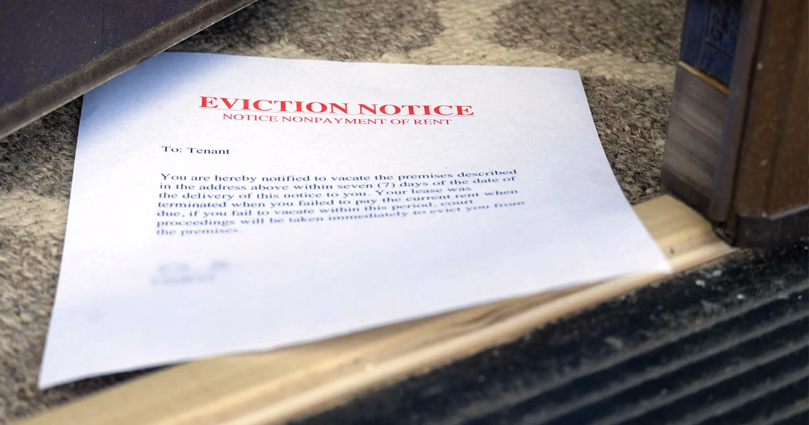 An eviction notice in an open doorway