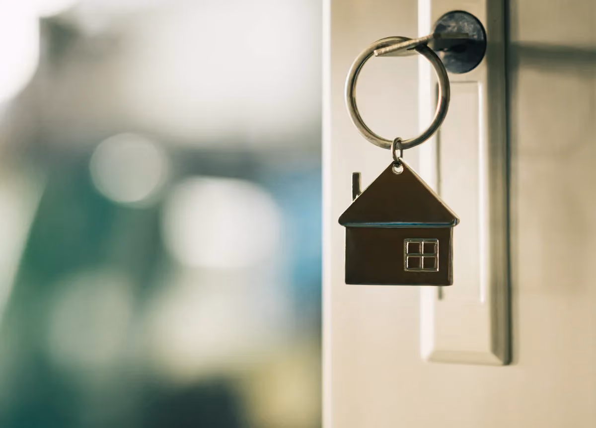 House key in front door keyhole