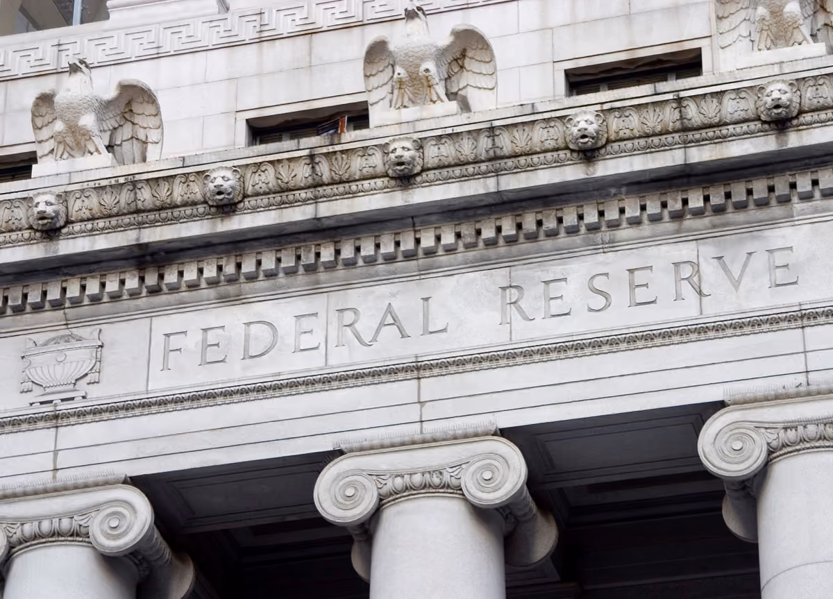 The facade of the Federal Reserve showing sculptures of eagles and lionheads with ornamental decorations