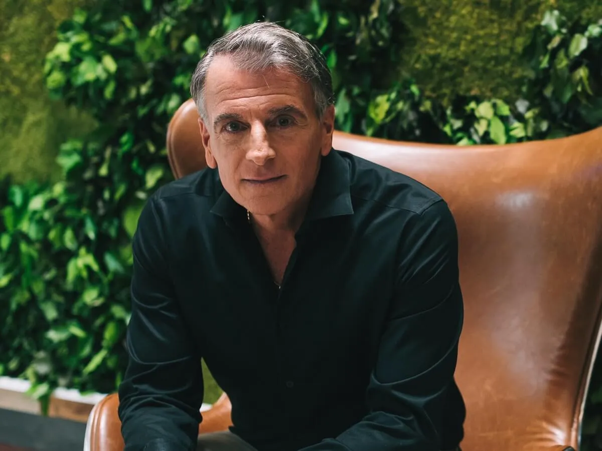 A photo of Stephan Tchividjian sitting on a leather couch