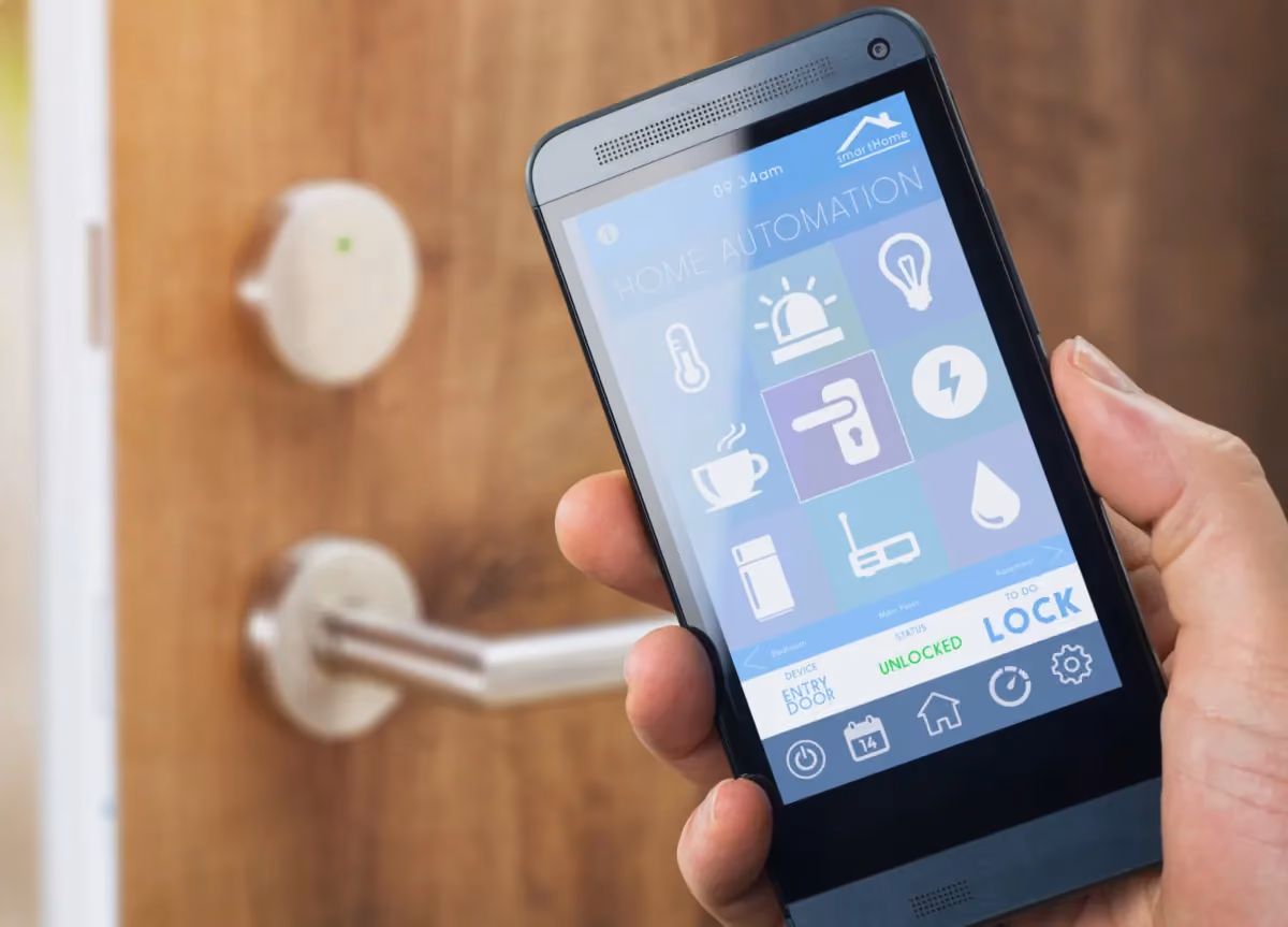 Person using a smartphone and smart key technology to unlock their front door
