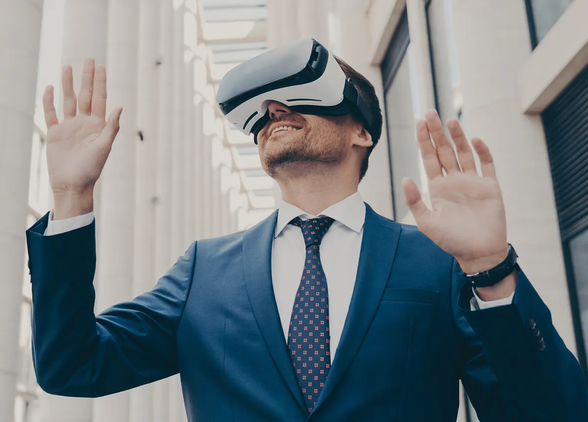 Businessman in suit wearing VR headset