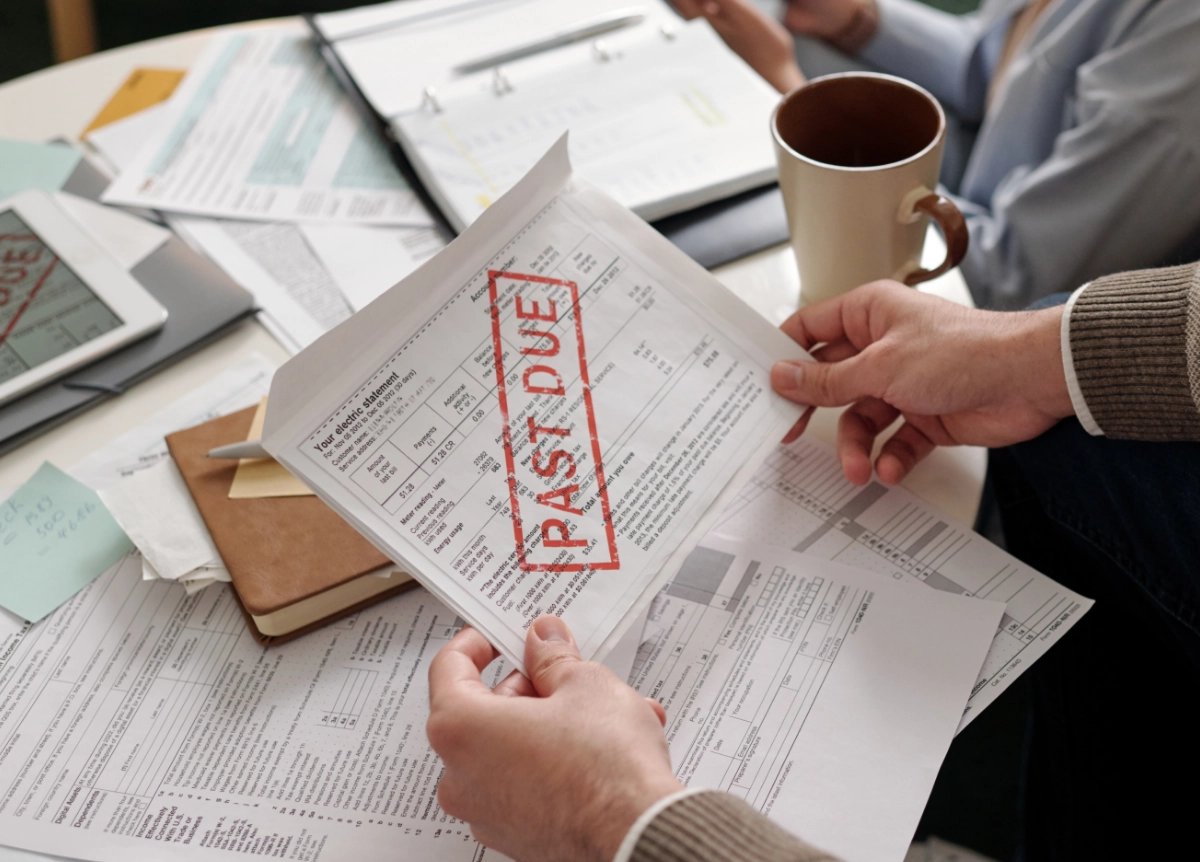 Man looking over bills that are past due